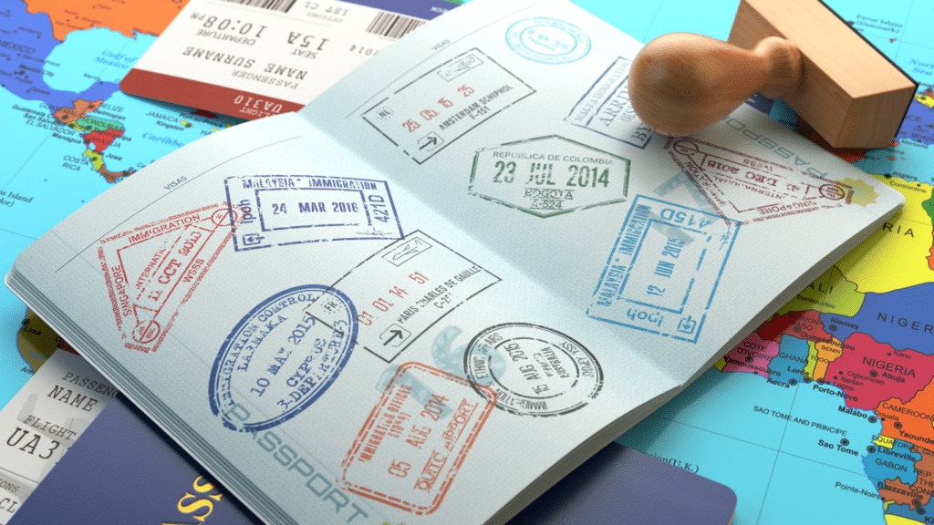 Traveler's passport displaying various stamps from different destinations around the world.