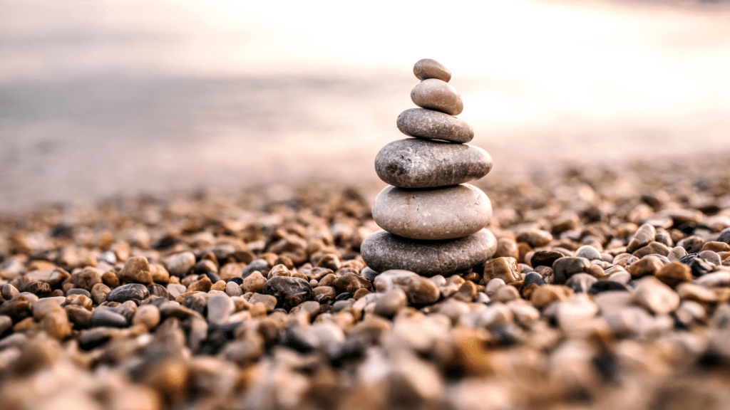 A pebble tower on a rocky beach.