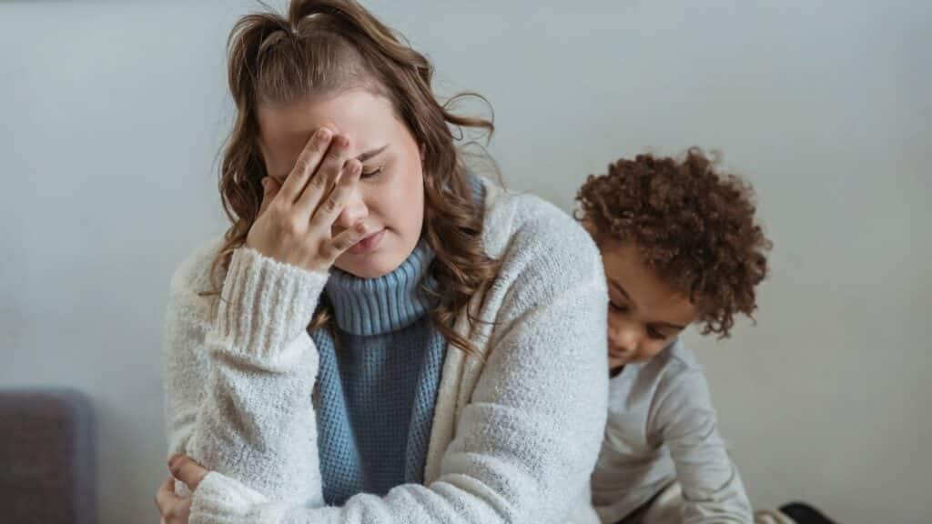 A mom with a tired look on her face.