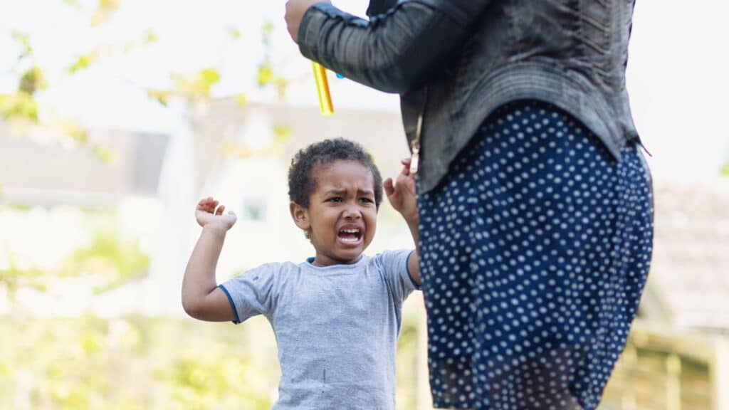 Toddler expressing big emotions during a meltdown.